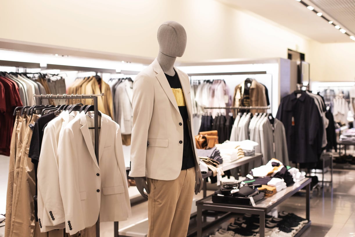 Men's Clothing, Fashionable, Stylish on Hangers in Stores, a Man